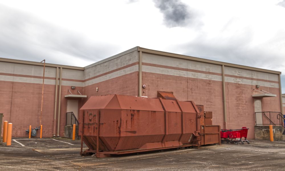 trash compactor outside of retail building