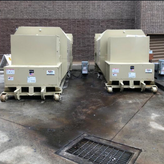 two CRA tan self-contained compactors
