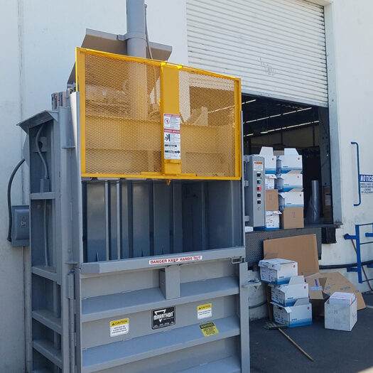 CRA vertical baler outside building baling cardboard